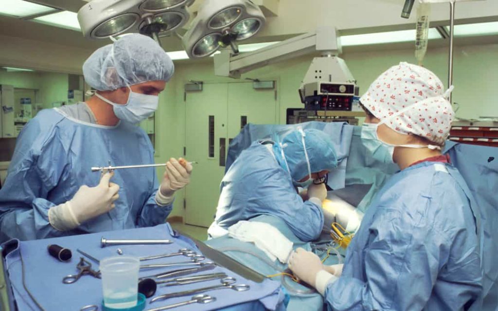 A group of plastic surgeons in an operating room in Tijuana.
