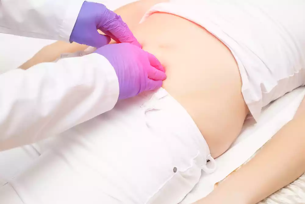 A woman is being examined by a doctor.